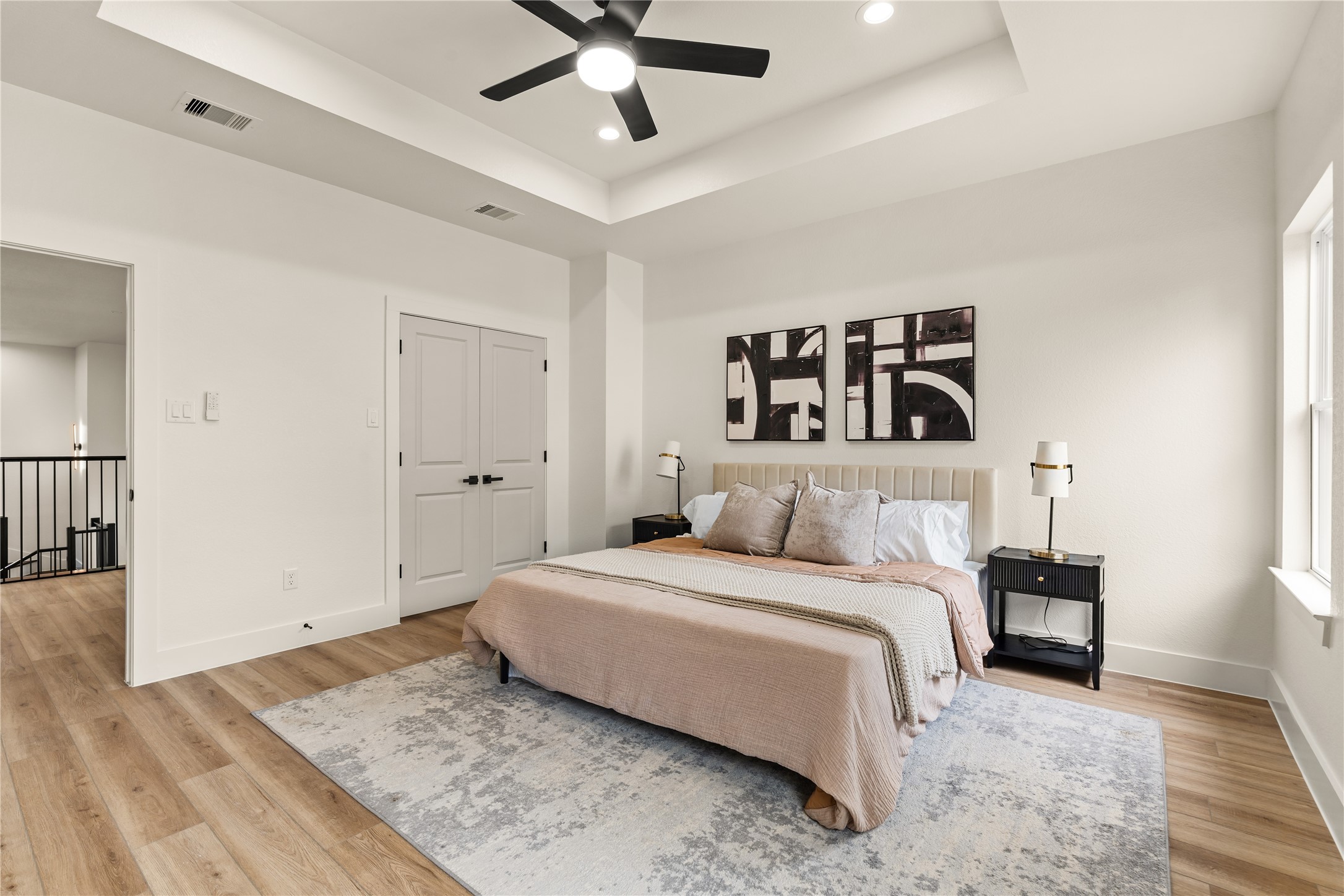 3539 Mainer Street, Unit B Houston, TX 77021 - Photo 15 of 29 Primary suite with tray ceiling detail, walk-in closet, and spacious layout