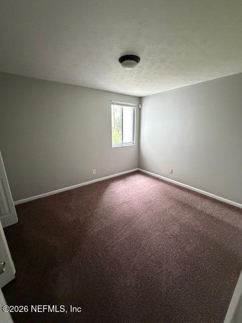 3048 Belden Street, Unit 5 Jacksonville, FL 32207 - Photo 3 of 7 an empty room with a window