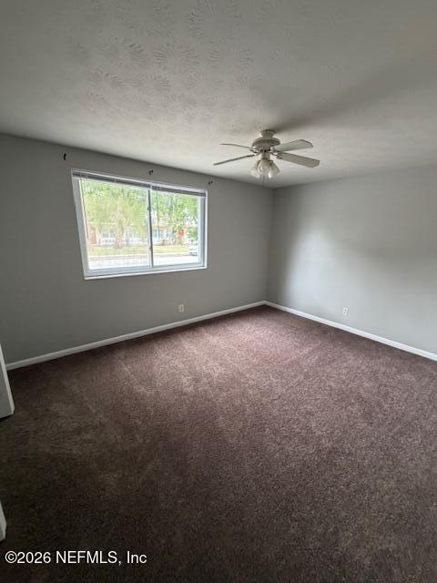 3048 Belden Street, Unit 5 Jacksonville, FL 32207 - Photo 5 of 7 an empty room with windows and fan