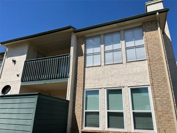 a house with trees in front of it