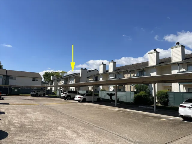 a picture of a wall with a white building