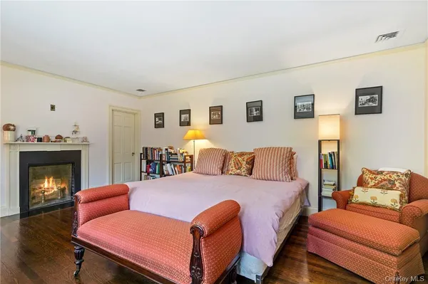 a bed room with a bed and a fireplace