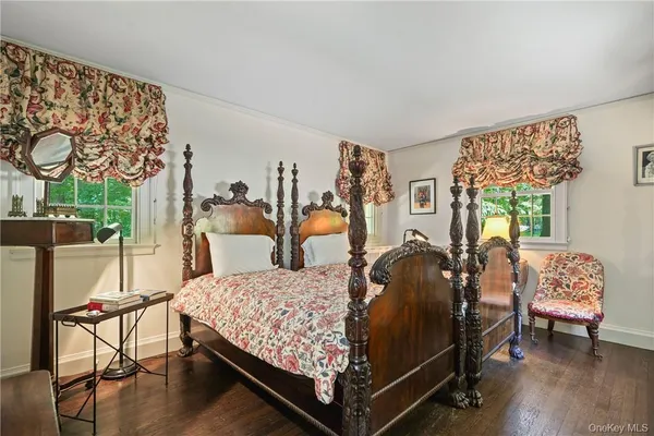 a bed room with a bed and a chair