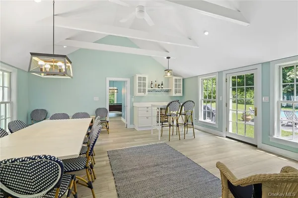 a view of a dining room with furniture window and outside view