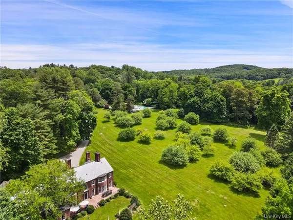 a aerial view of a house with a yard