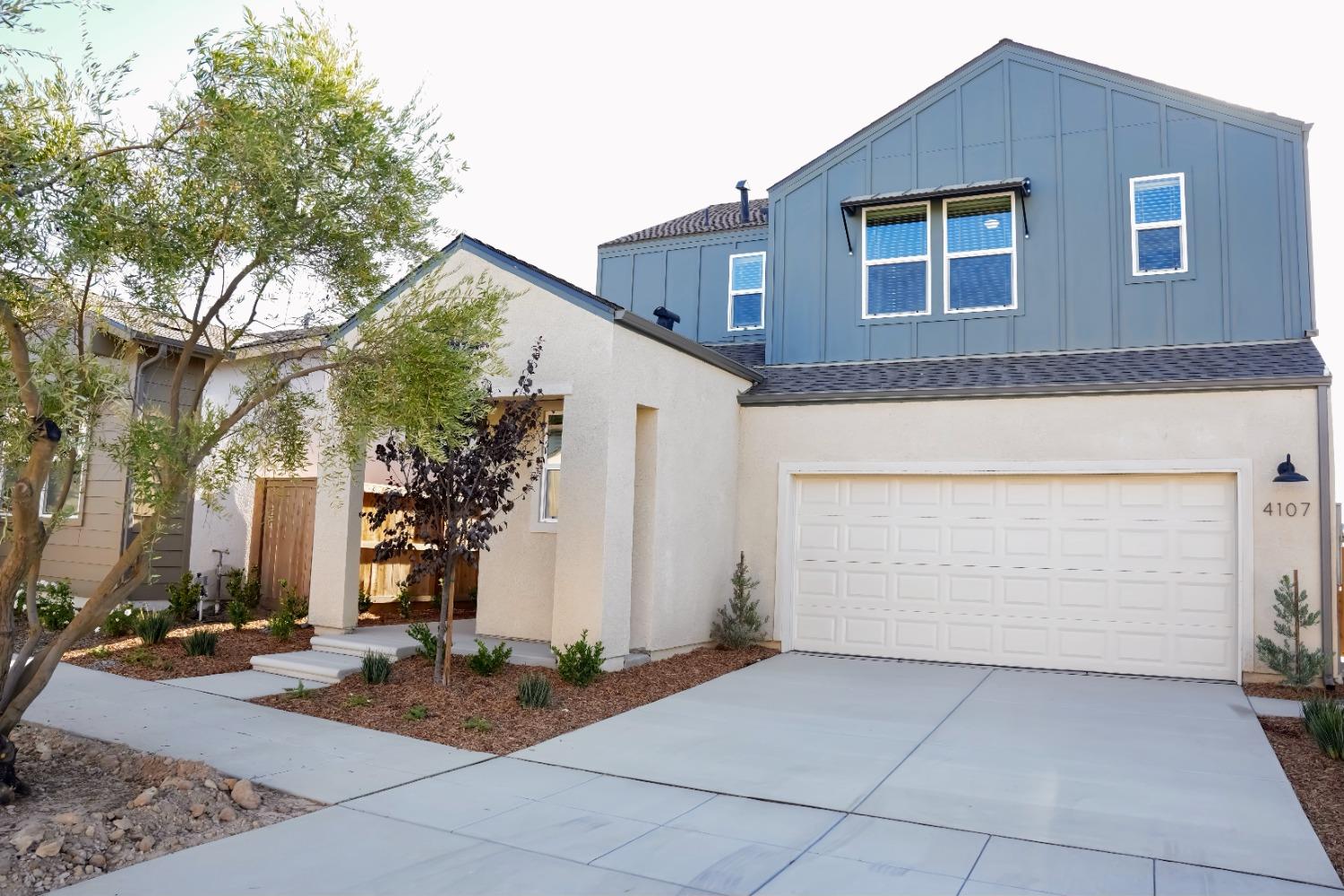 4107 Braden Road Madera, CA 93636 - Photo 1 of 17 a front view of a house with yard
