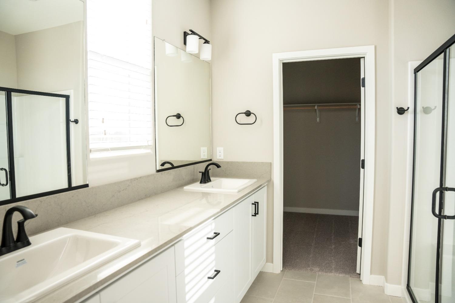 4107 Braden Road Madera, CA 93636 - Photo 5 of 17 a bathroom with a sink and a mirror