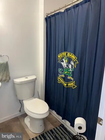 a bathroom with a toilet and a sink
