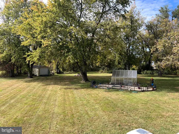 a view of a swimming pool with an outdoor seating