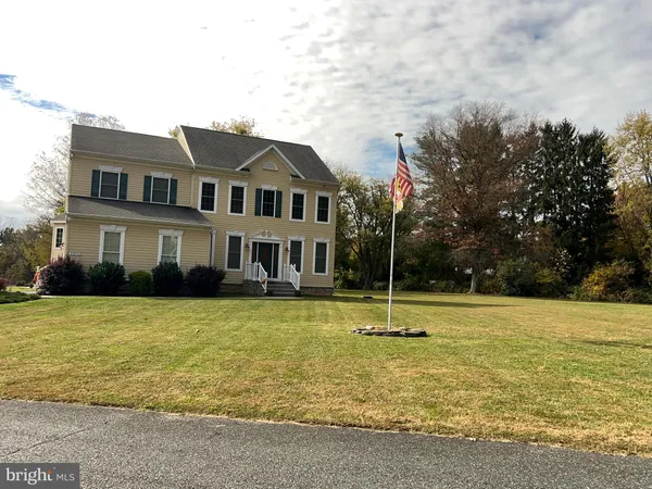 a house with swimming pool in front of it