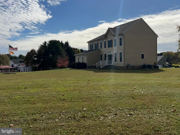 a view of a house with a big yard