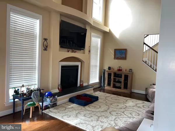 a bedroom with furniture and a fireplace