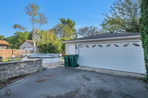 front view of a house with a large tree