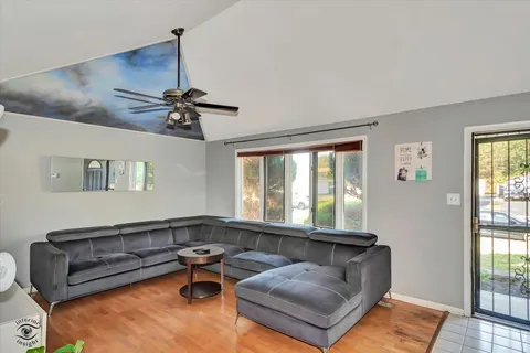 a living room with furniture and a window