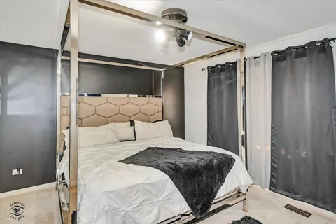a bedroom with a bed and a walk in closet