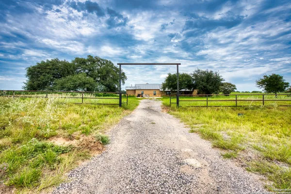 a view of a swimming pool and a yard