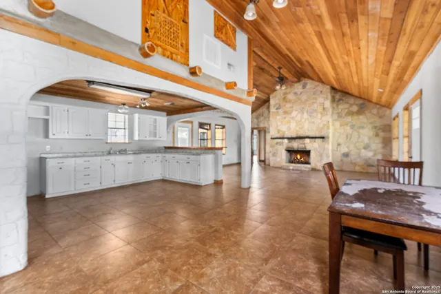 a view of a kitchen with a sink and cabinets