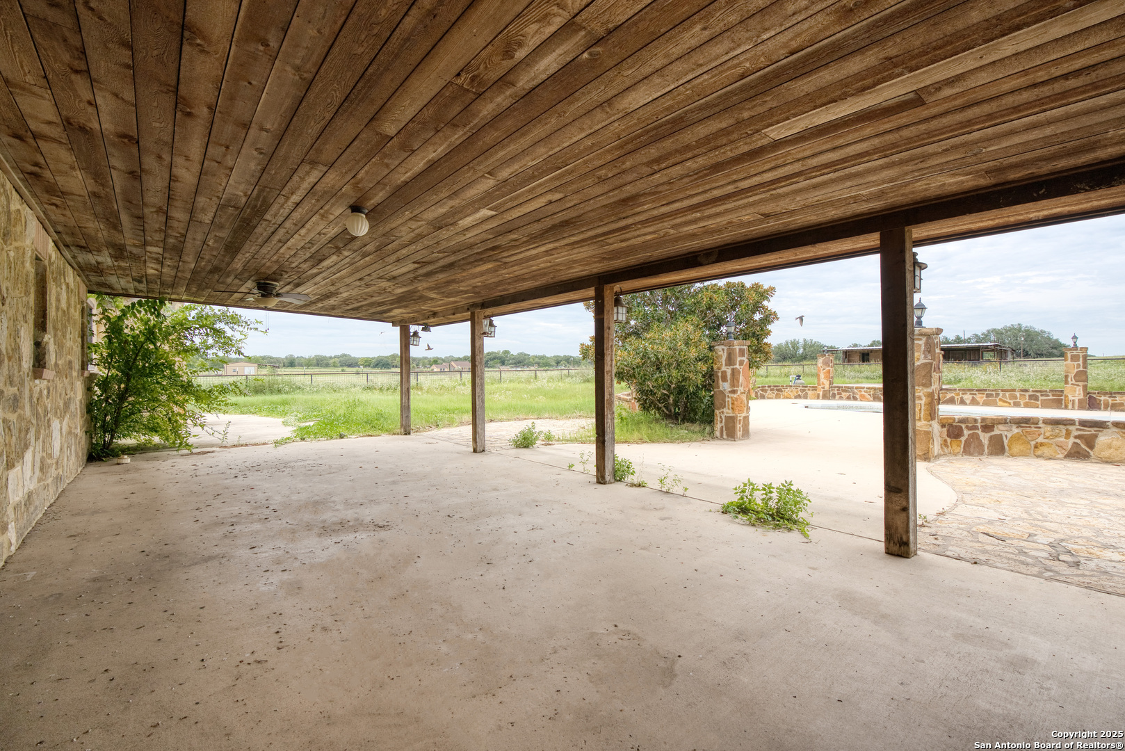 870 County Road 761 Devine, TX 78016 - Photo 24 of 34 a view of a room with a big yard