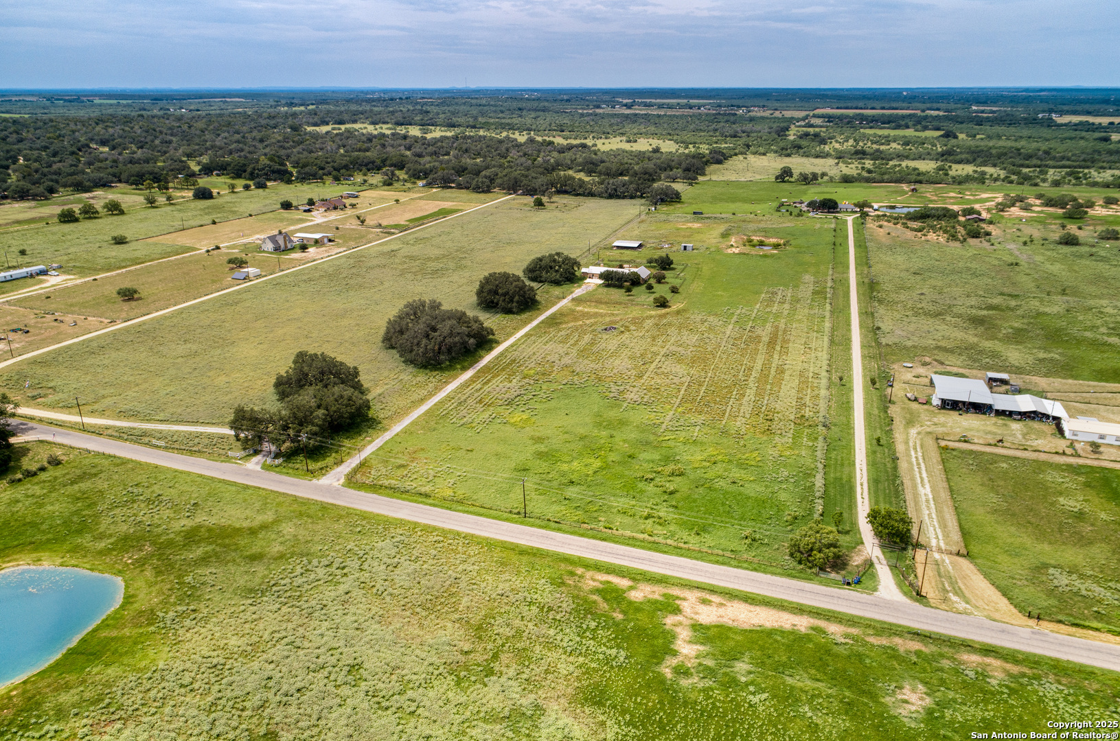 870 County Road 761 Devine, TX 78016 - Photo 28 of 34 a view of a swimming pool and an ocean