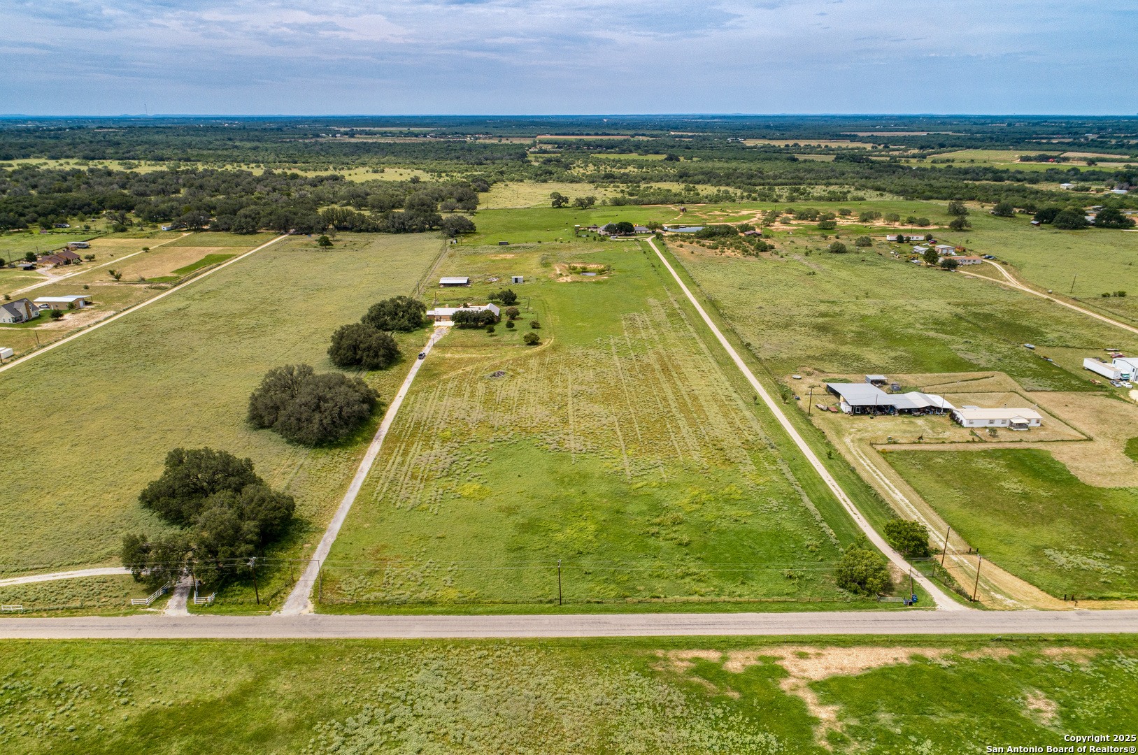 870 County Road 761 Devine, TX 78016 - Photo 31 of 34 a view of an outdoor space and swimming pool
