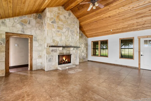a view of an empty room with a fireplace