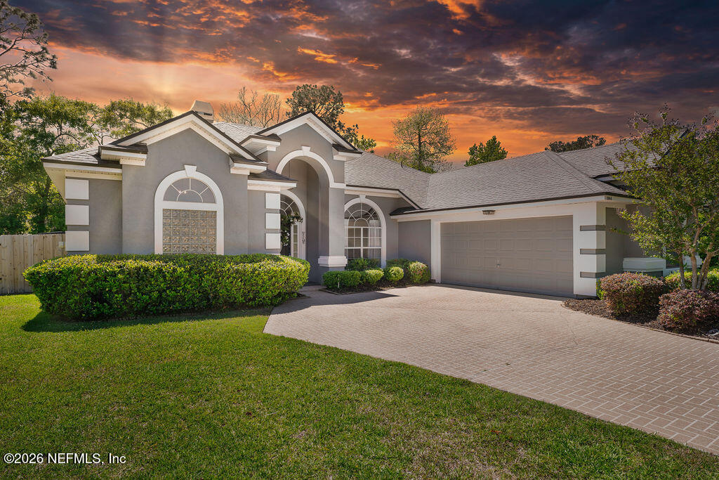 a front view of a house with a yard