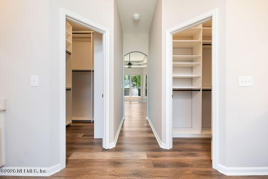 1984 Bluebonnet Way Fleming Island, FL 32003 - Photo 24 of 69 a view of a hallway with wooden floor and door