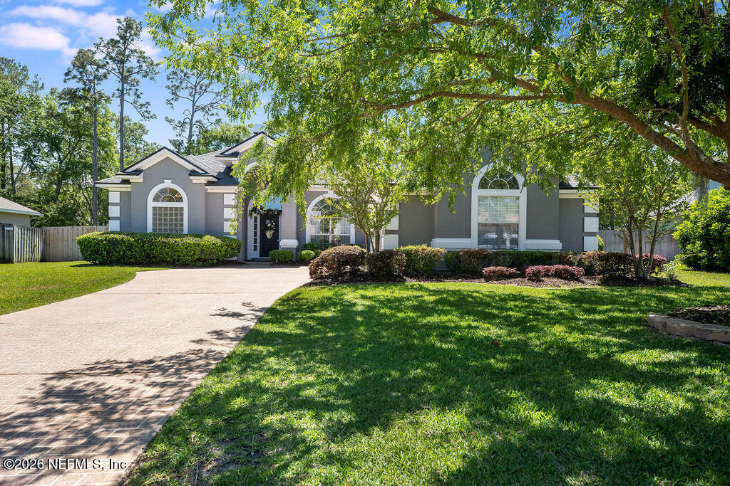 1984 Bluebonnet Way Fleming Island, FL 32003 - Photo 4 of 69 a front view of a house with garden