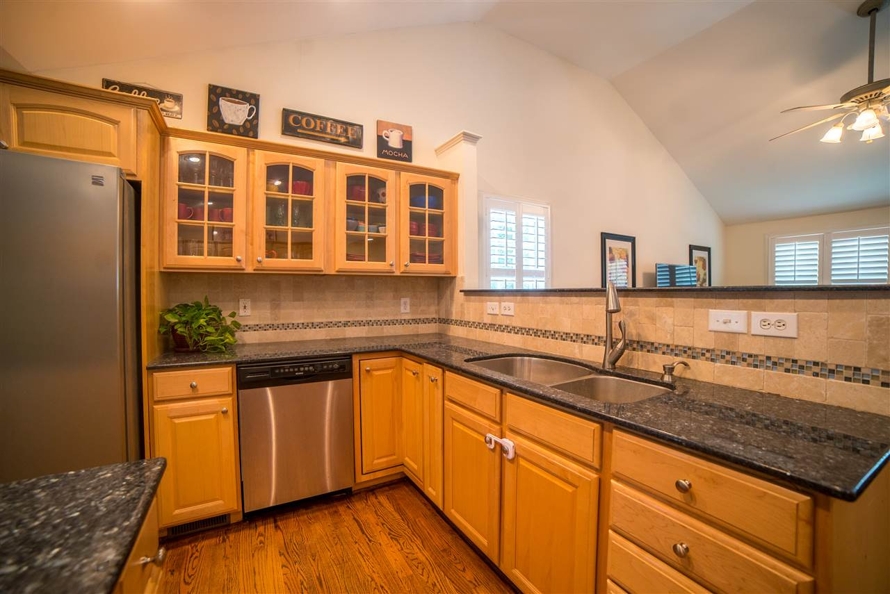 2909 Oberlin Road Raleigh, NC 27608 - Photo 7 of 25 Granite countertop & tile backsplash