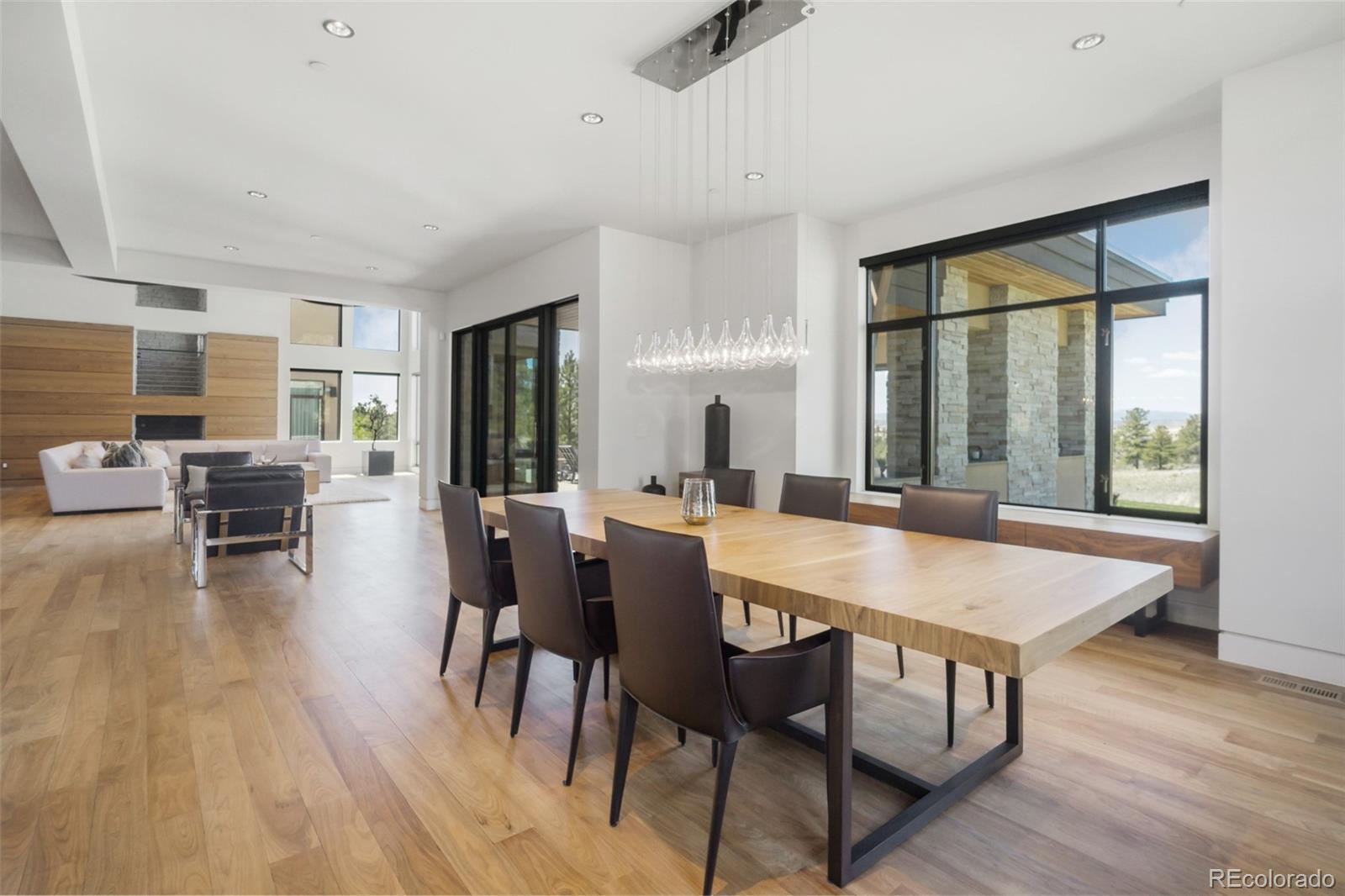 7895 Forest Keep Circle Parker, CO 80134 - Photo 13 of 40 a view of a dining room with furniture window and wooden floor