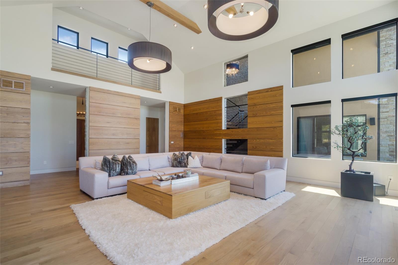 7895 Forest Keep Circle Parker, CO 80134 - Photo 15 of 40 a living room with furniture and a fireplace