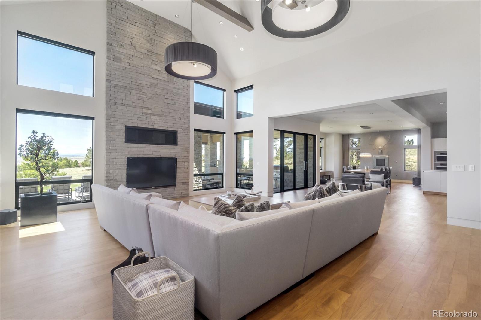 7895 Forest Keep Circle Parker, CO 80134 - Photo 17 of 40 a living room with furniture and a fireplace