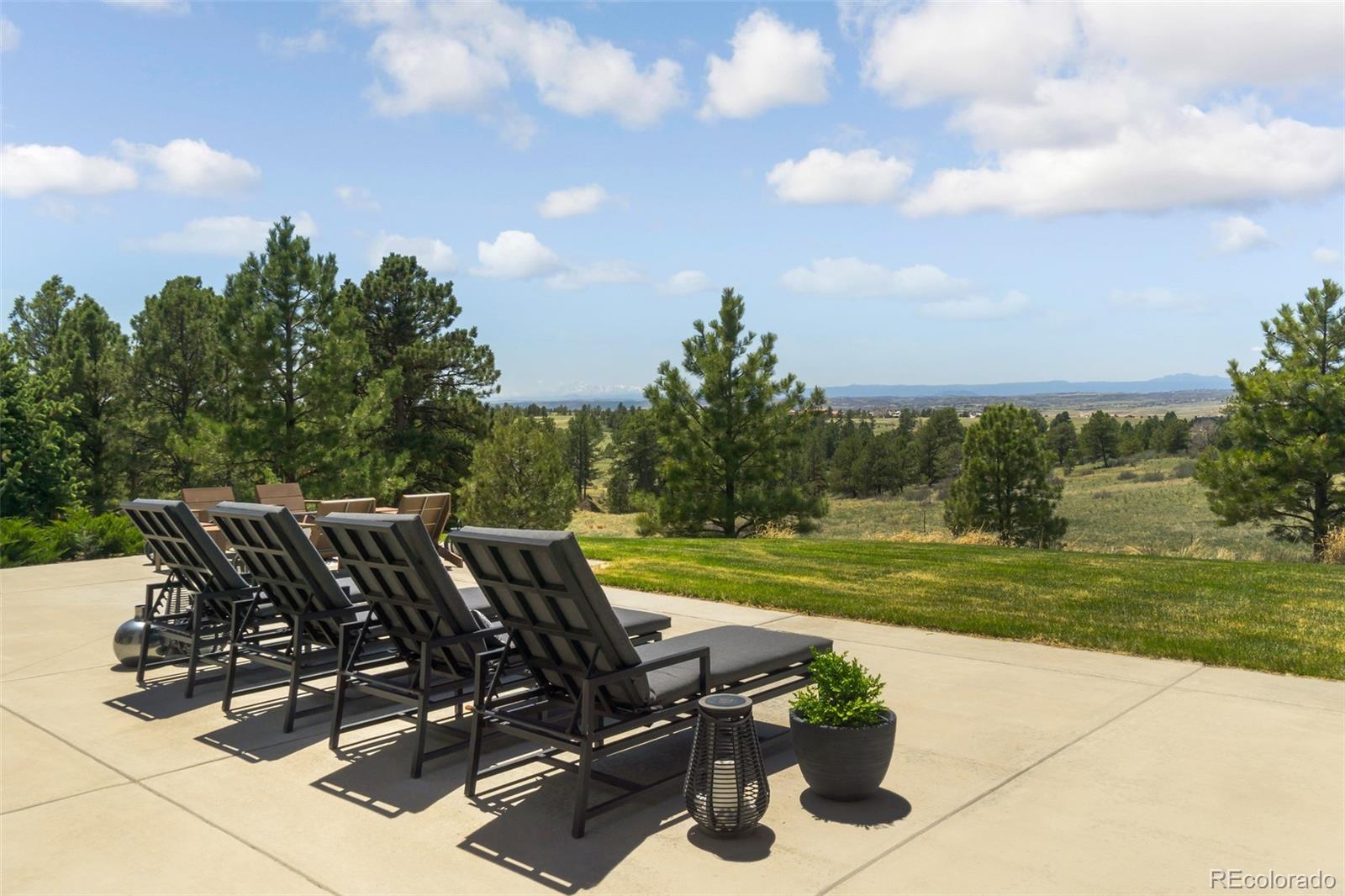 7895 Forest Keep Circle Parker, CO 80134 - Photo 22 of 40 a view of a yard with table and chairs and a yard