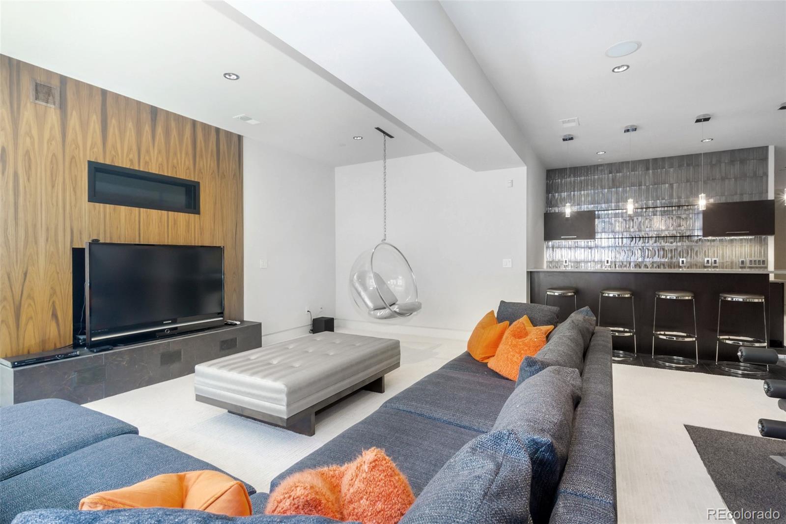 7895 Forest Keep Circle Parker, CO 80134 - Photo 27 of 40 a living room with furniture and a flat screen tv