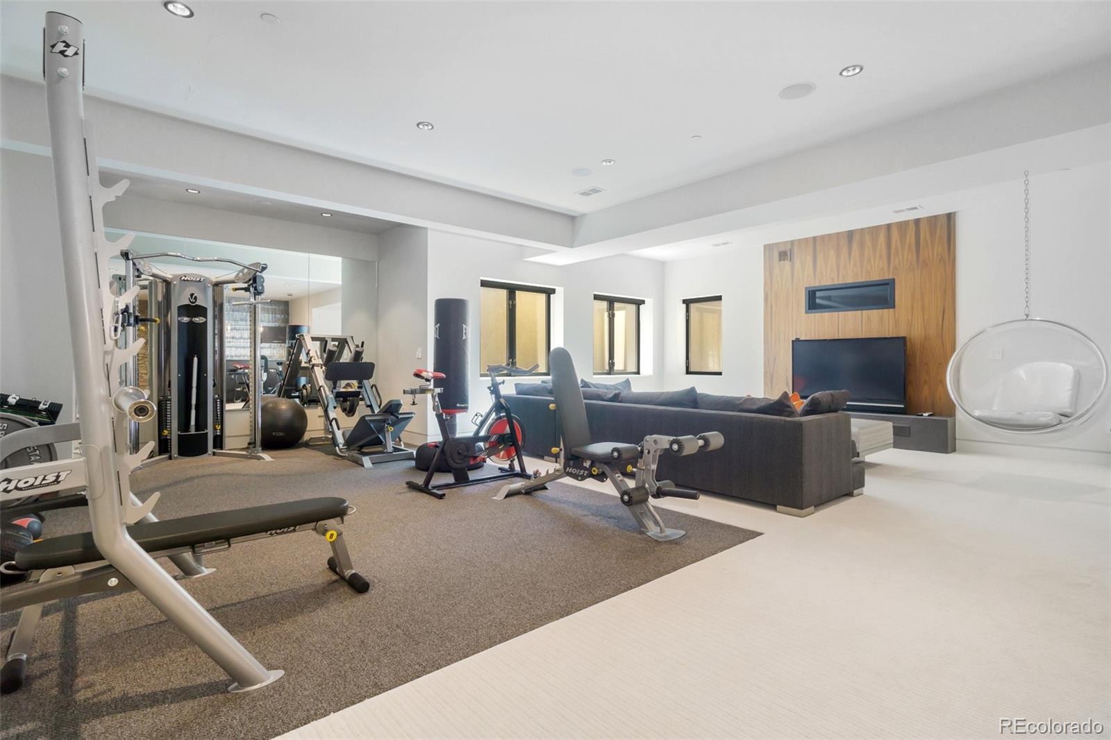 7895 Forest Keep Circle Parker, CO 80134 - Photo 28 of 40 a living room with furniture gym equipment and a window