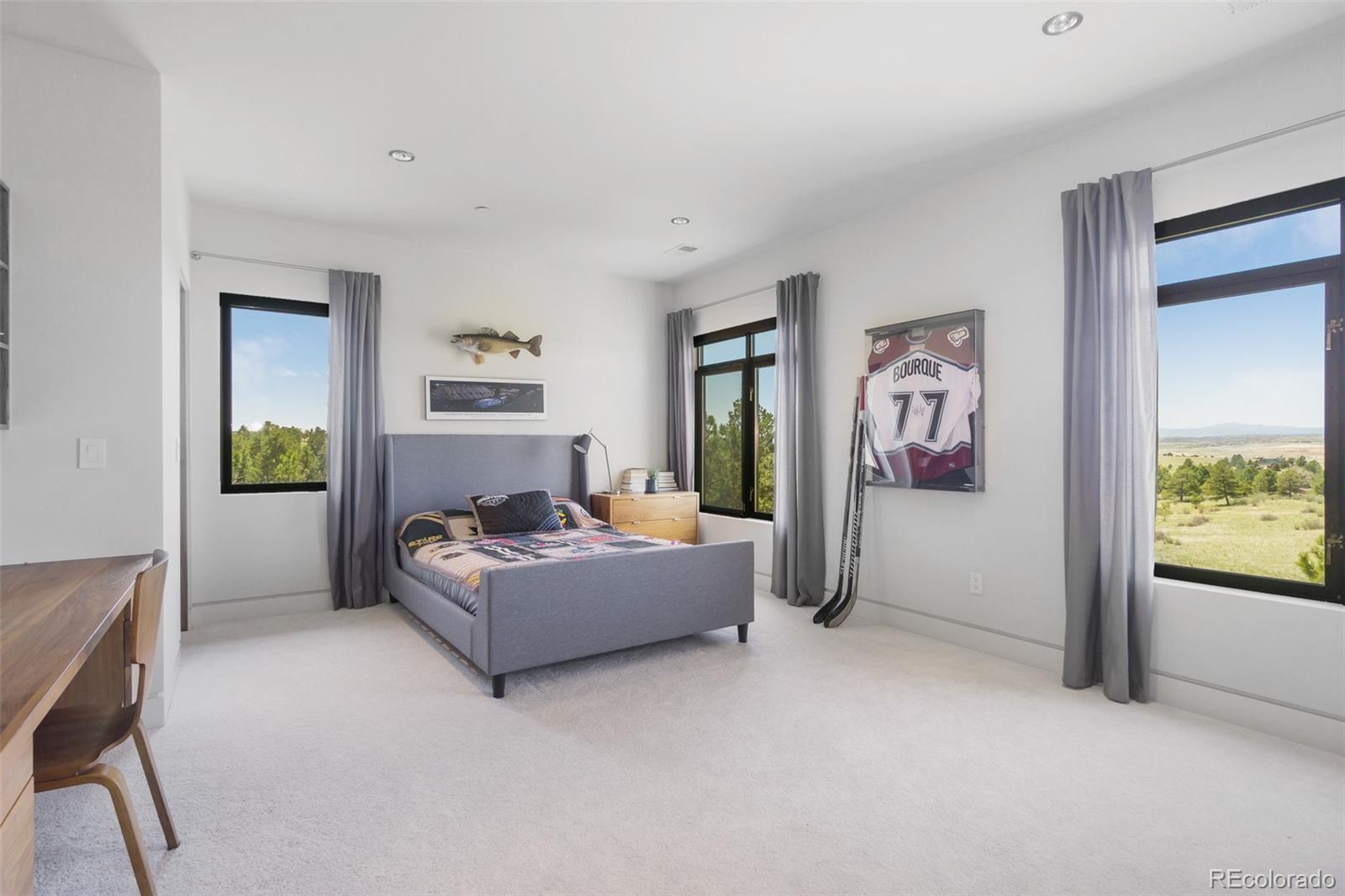 7895 Forest Keep Circle Parker, CO 80134 - Photo 31 of 40 a living room with furniture and a gate