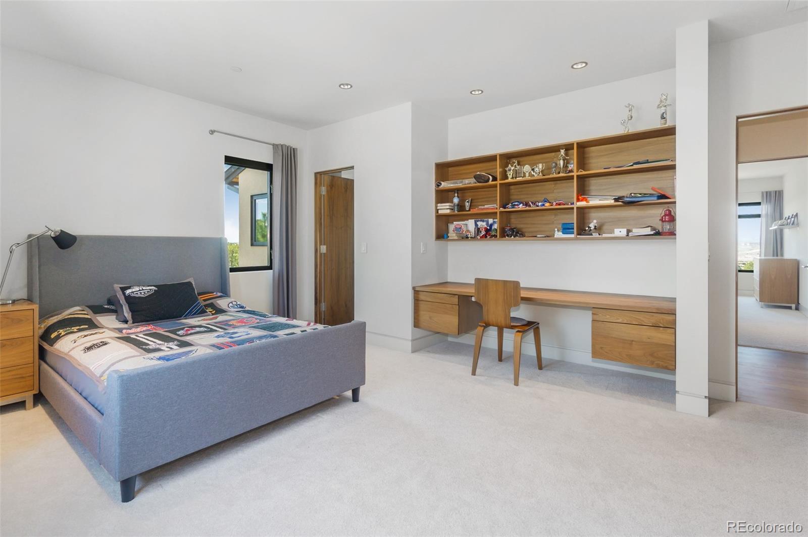 7895 Forest Keep Circle Parker, CO 80134 - Photo 33 of 40 a bedroom with a bed and a cabinets