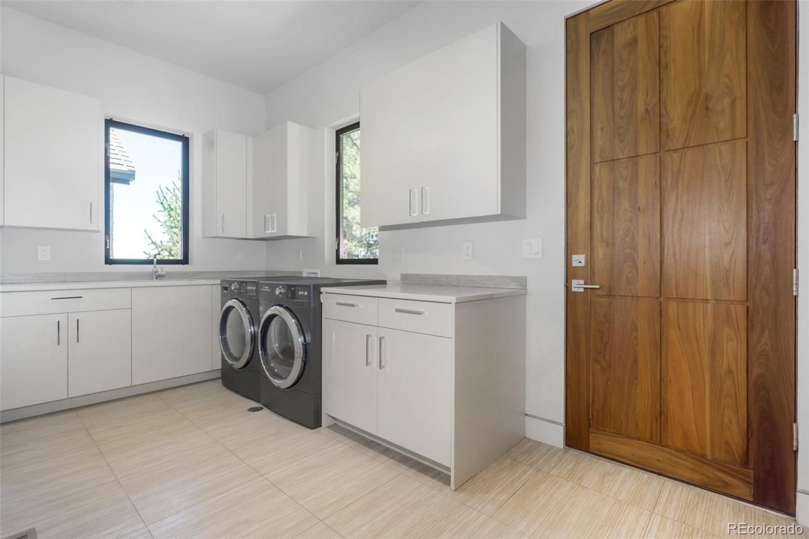 7895 Forest Keep Circle Parker, CO 80134 - Photo 34 of 40 a utility room with dryer and washer
