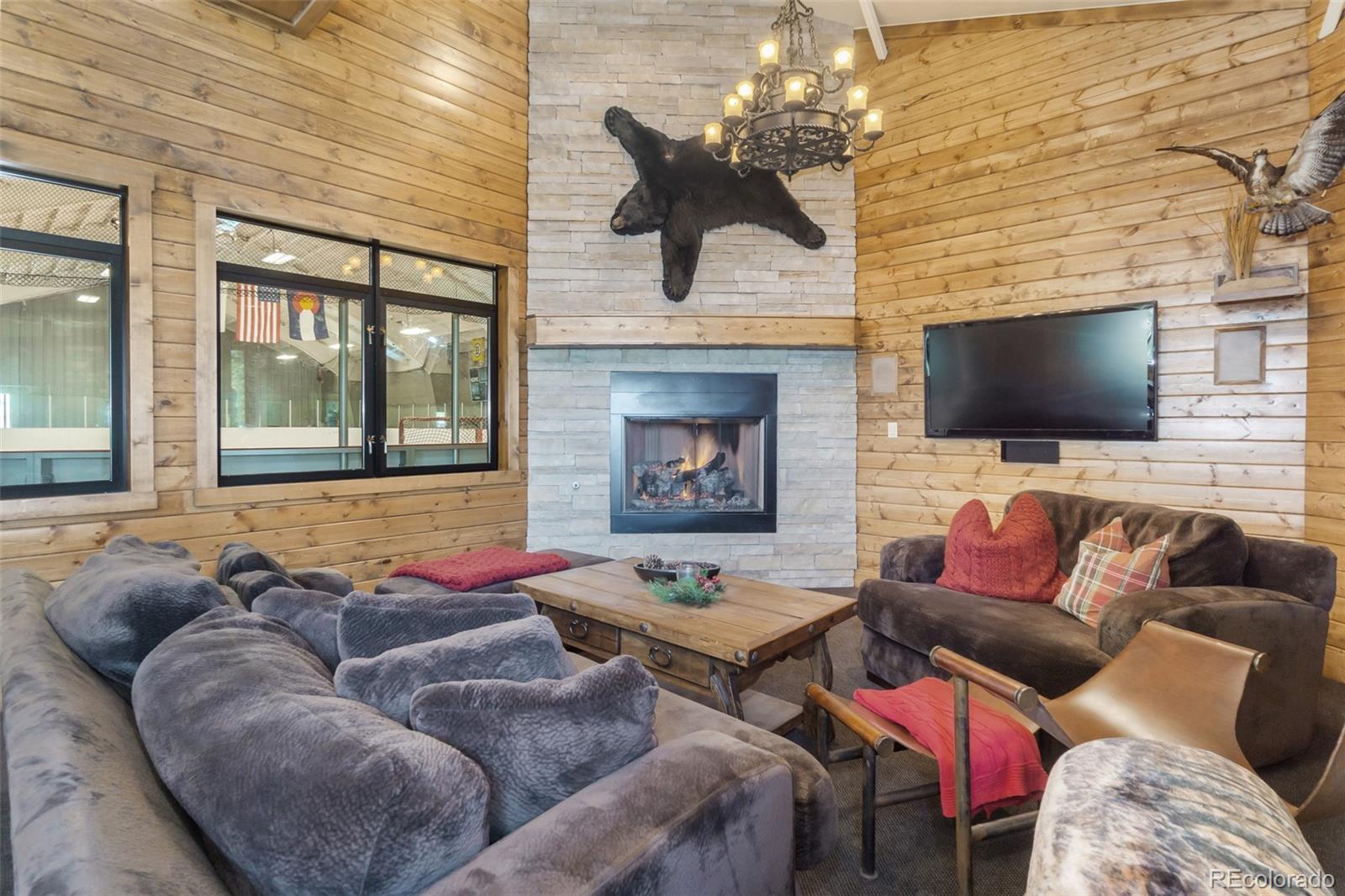 7895 Forest Keep Circle Parker, CO 80134 - Photo 36 of 40 a living room with furniture and a flat screen tv