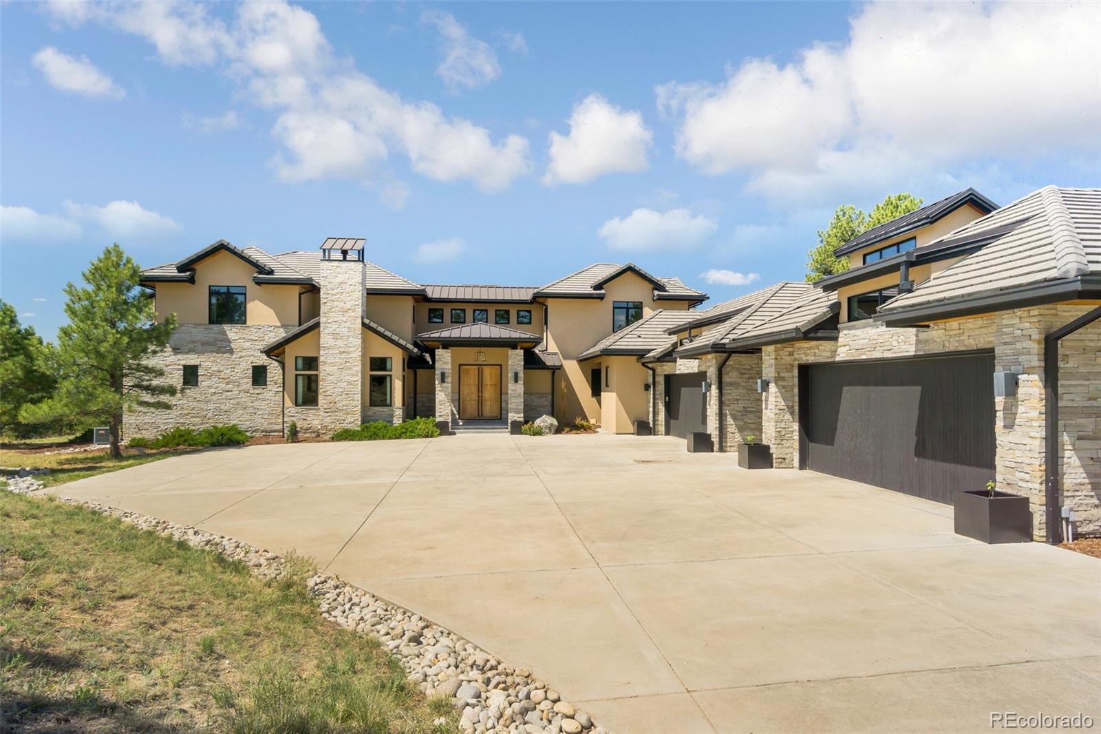 7895 Forest Keep Circle Parker, CO 80134 - Photo 39 of 40 a front view of a house with a garden