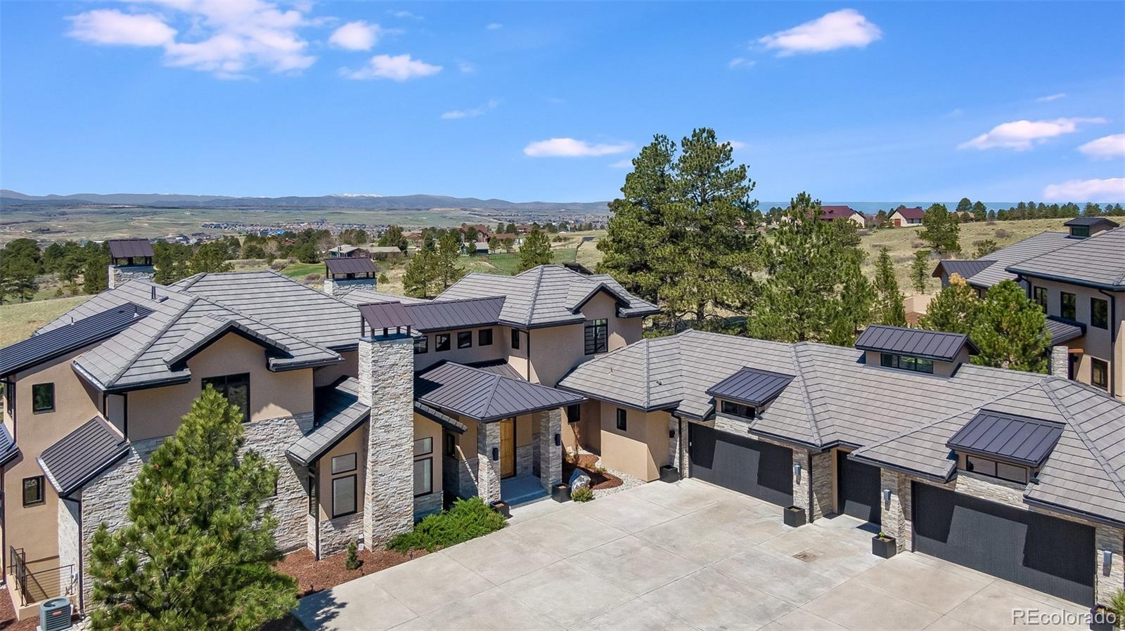 7895 Forest Keep Circle Parker, CO 80134 - Photo 4 of 40 an aerial view of a house with a yard wooden table and chairs