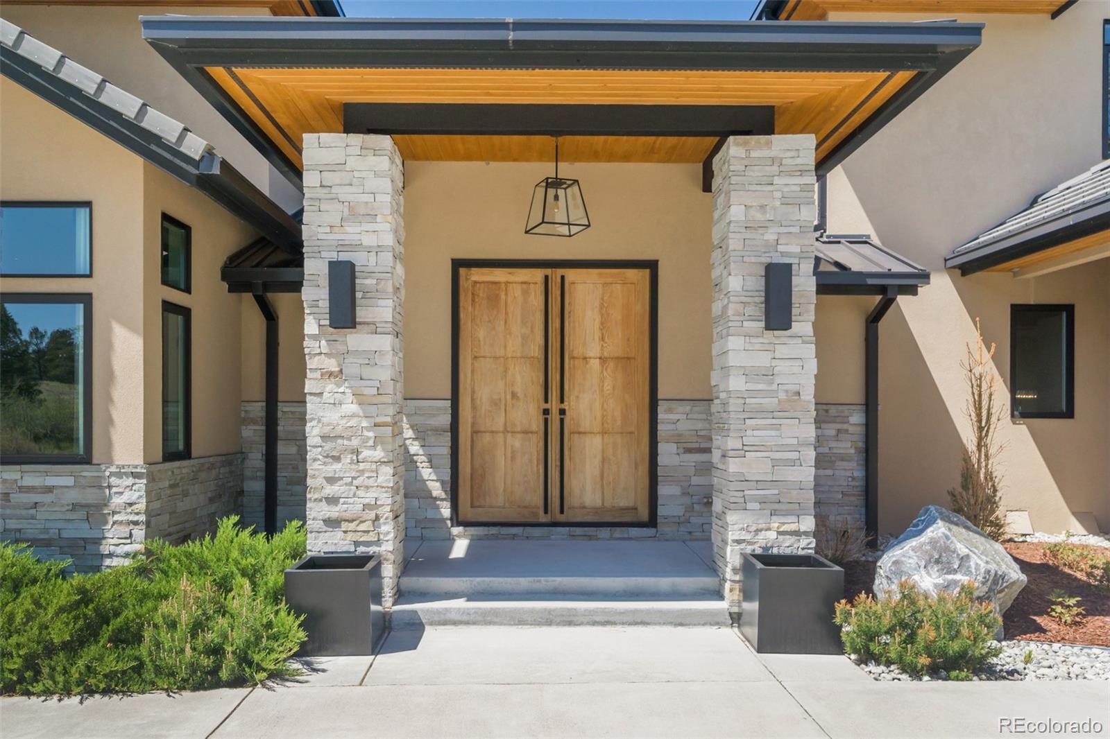 7895 Forest Keep Circle Parker, CO 80134 - Photo 6 of 40 a front view of a house with a garage