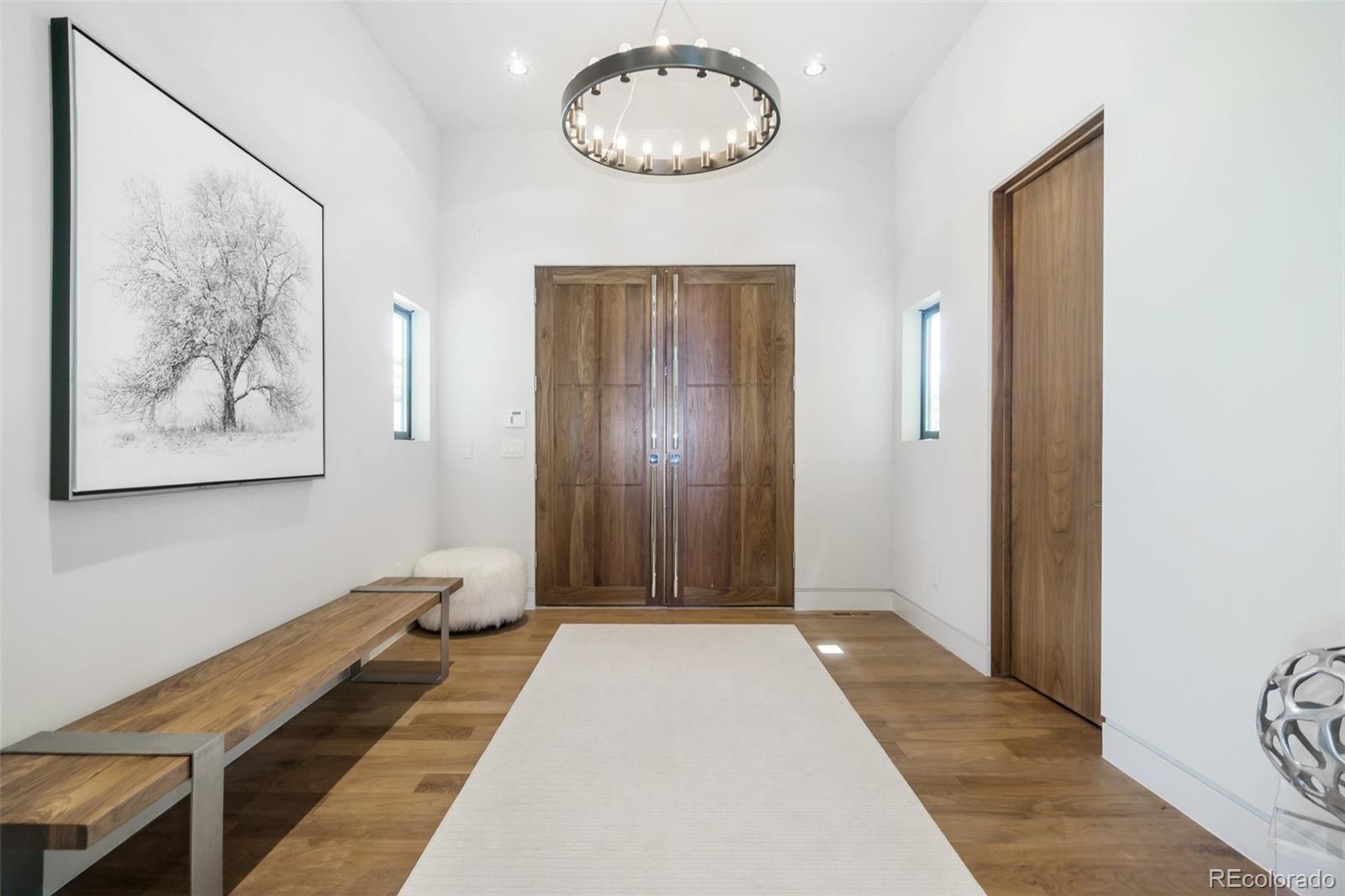 7895 Forest Keep Circle Parker, CO 80134 - Photo 8 of 40 a view of a hallway with wooden floor