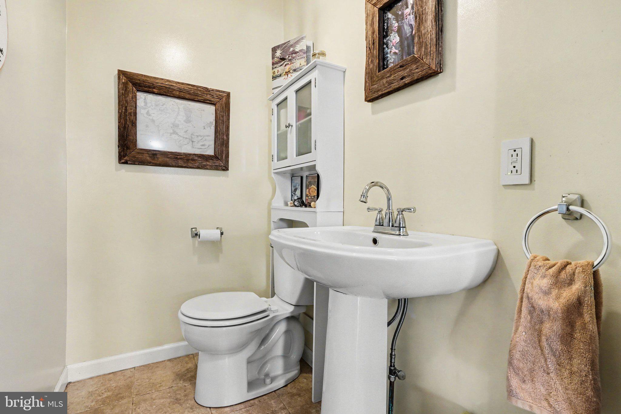 321 Walnut Street Lemoyne, PA 17043 - Photo 14 of 34 a bathroom with a toilet sink and mirror