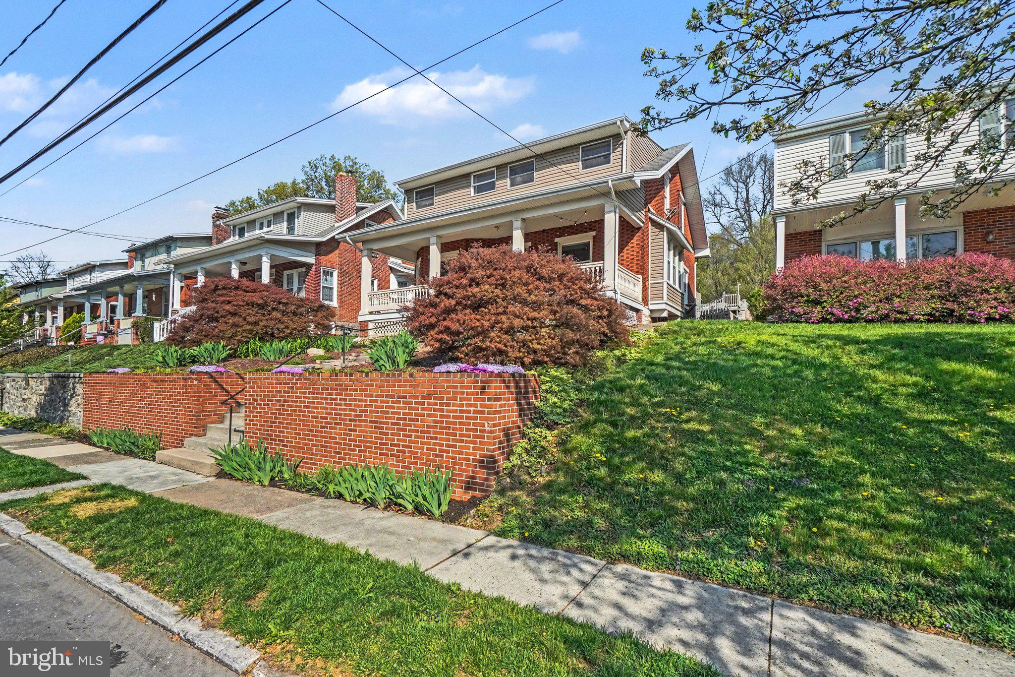 321 Walnut Street Lemoyne, PA 17043 - Photo 2 of 34 a front view of a house with garden