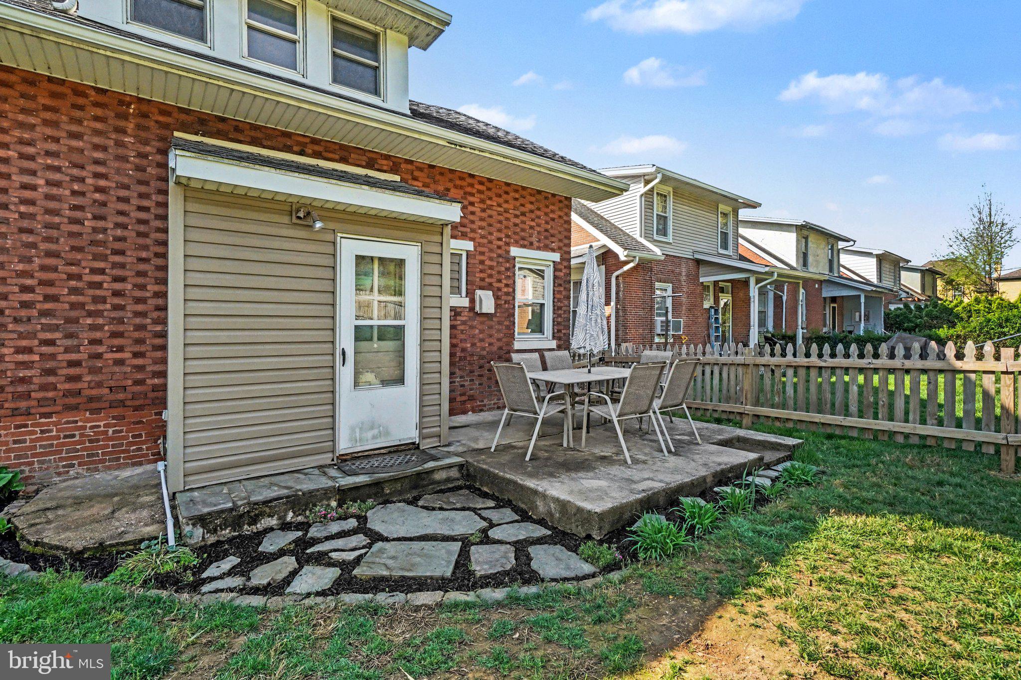 321 Walnut Street Lemoyne, PA 17043 - Photo 23 of 34 a view of a house with patio and a garden
