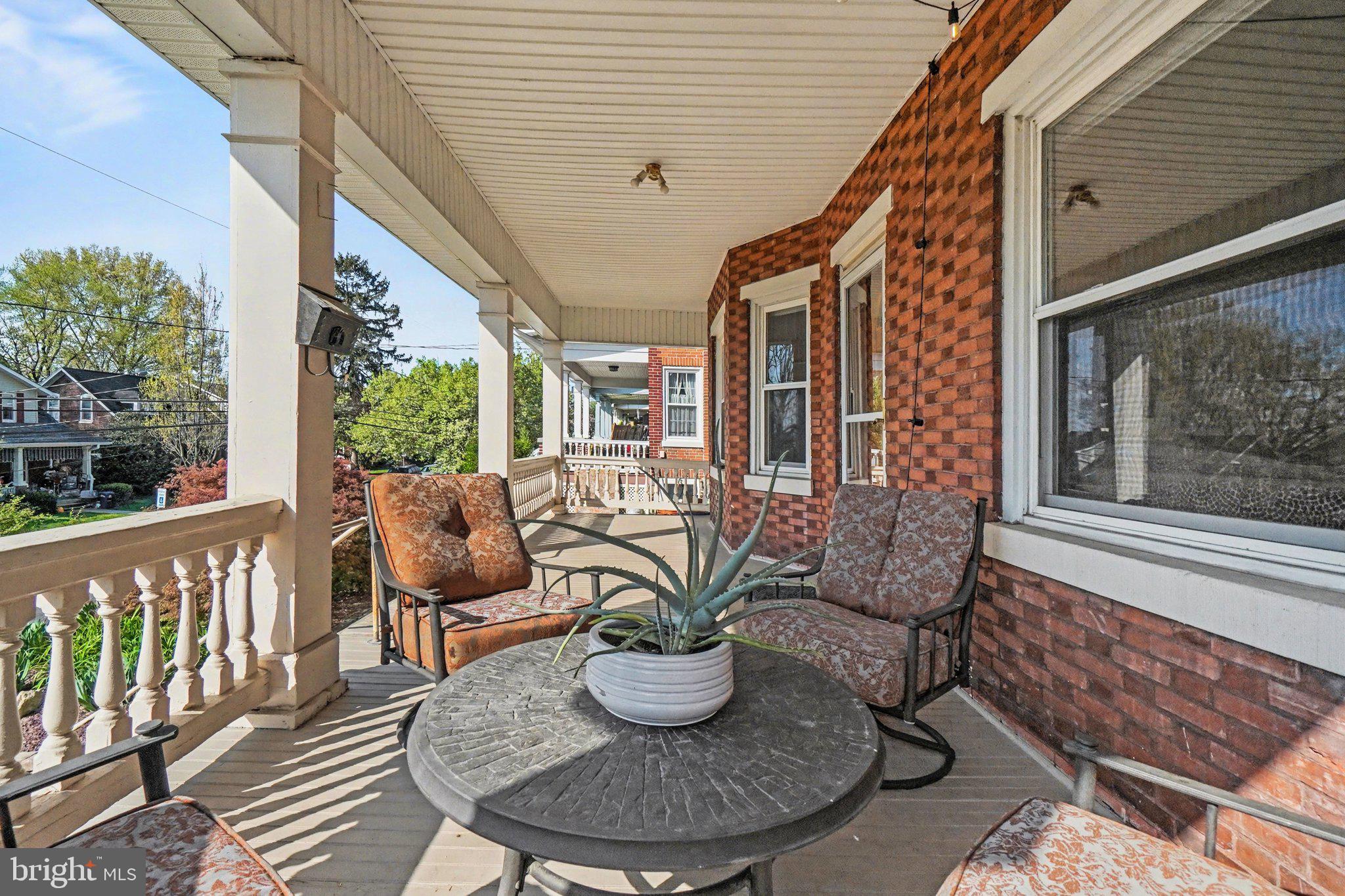321 Walnut Street Lemoyne, PA 17043 - Photo 3 of 34 a view of a patio with couches chairs and potted plants