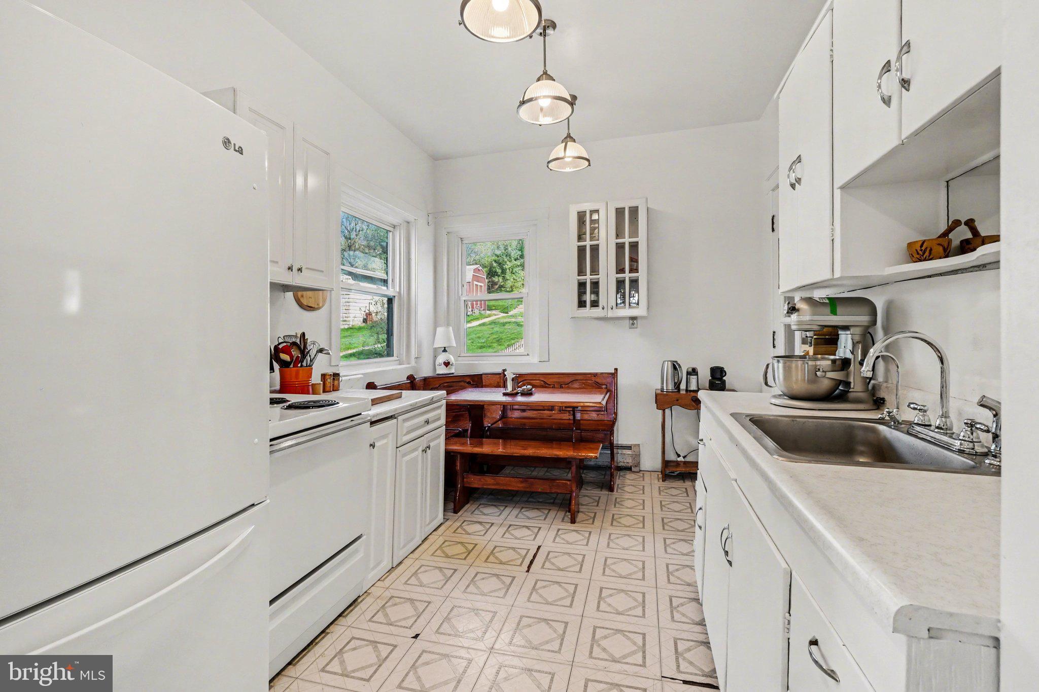 321 Walnut Street Lemoyne, PA 17043 - Photo 10 of 34 a kitchen with a sink stove and cabinets