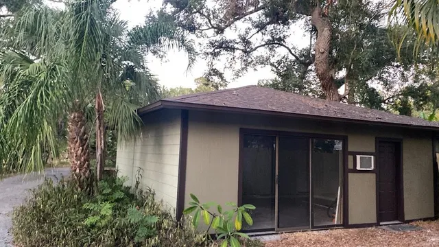 a house with a tree in front of it