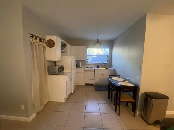 a kitchen with a sink a counter top space and appliances